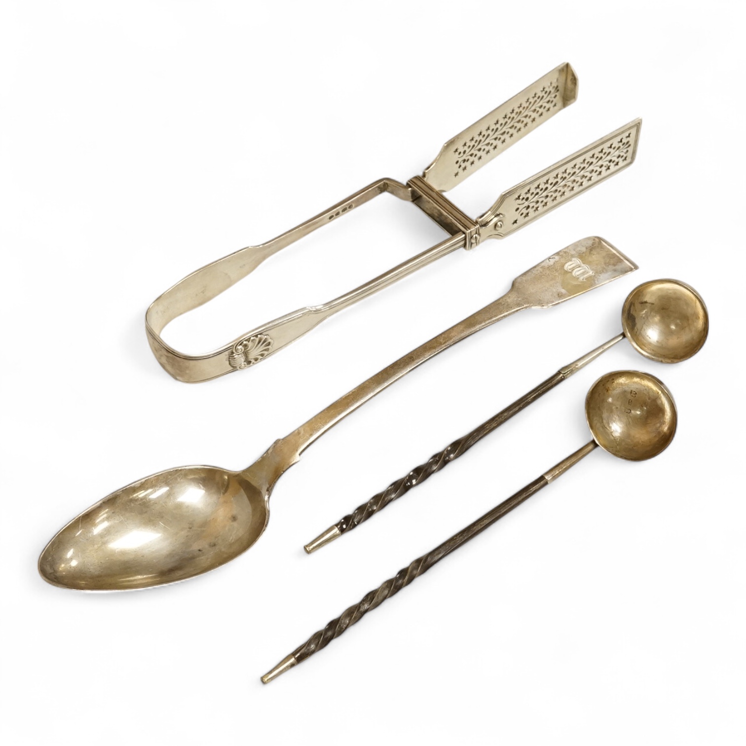 A pair of William IV silver fiddle, thread and shall pattern asparagus servers, a George IV silver fiddle pattern basting spoon, Robert Gainsford, Sheffield, 1826, 31.2cm, 10.8oz and two 19th century white metal toddy la